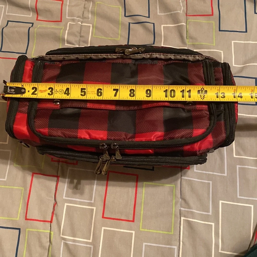 Lug Trolley Xl red buffalo checkered traveling bag.